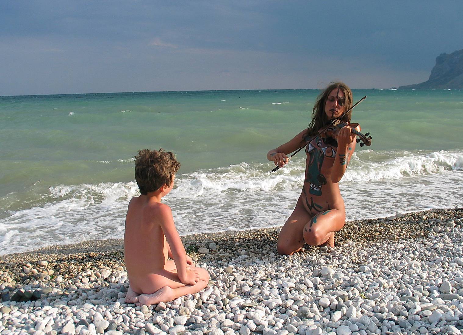 [Image: Seaside-Soothing-Violinist-Pure-Nudism-Images-4.jpg]